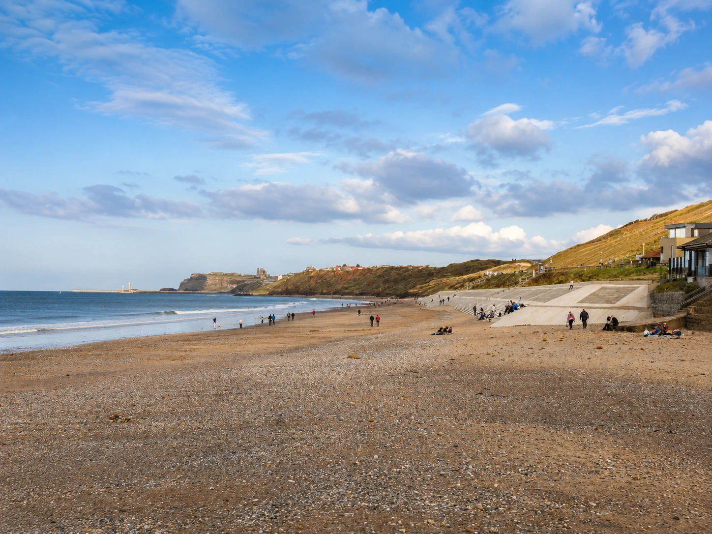 Wide view along Sandsend beach towards Whitby